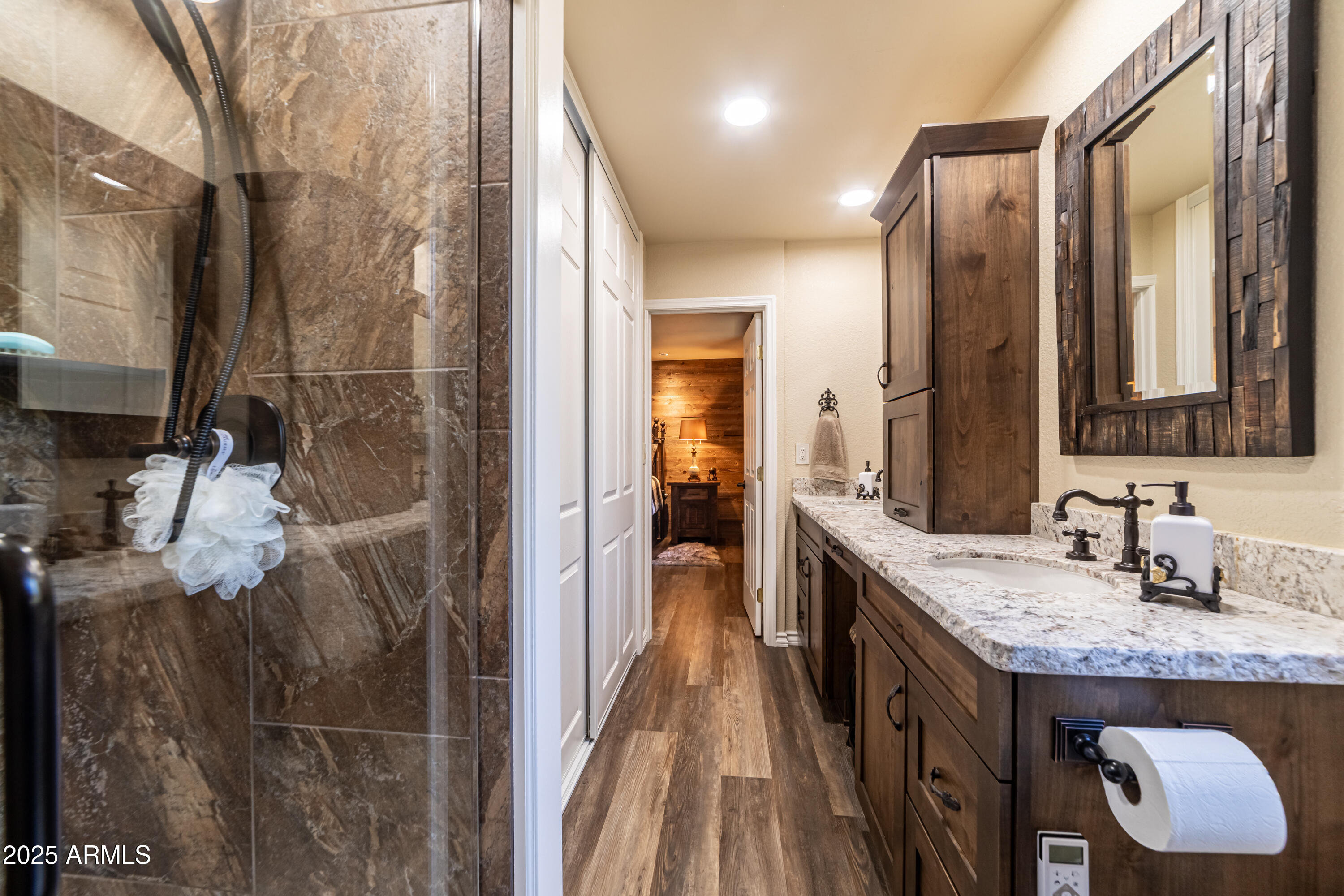 3929 East Sheldon Road Prescott, AZ 86303 - Photo 21 of 36 a bathroom with a granite countertop sink a mirror and shower