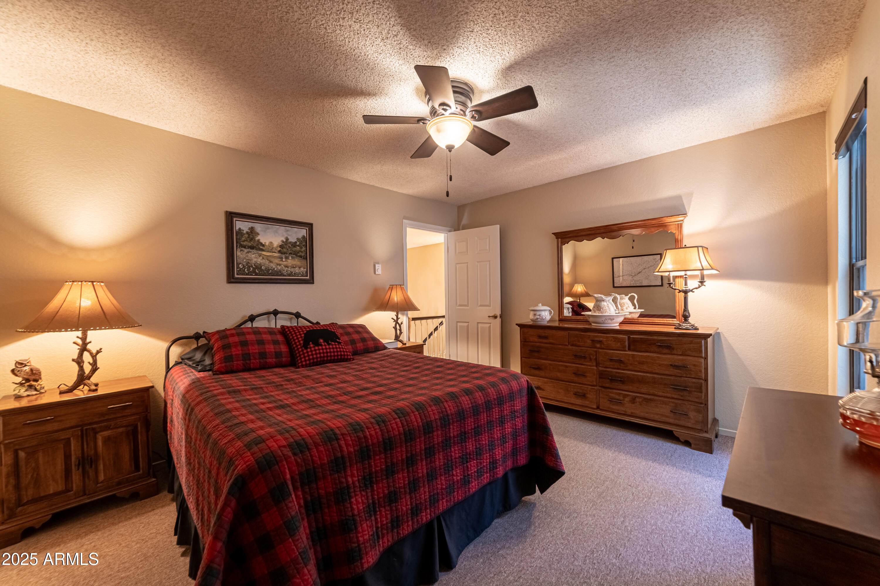3929 East Sheldon Road Prescott, AZ 86303 - Photo 24 of 36 a bedroom with a bed and a dresser