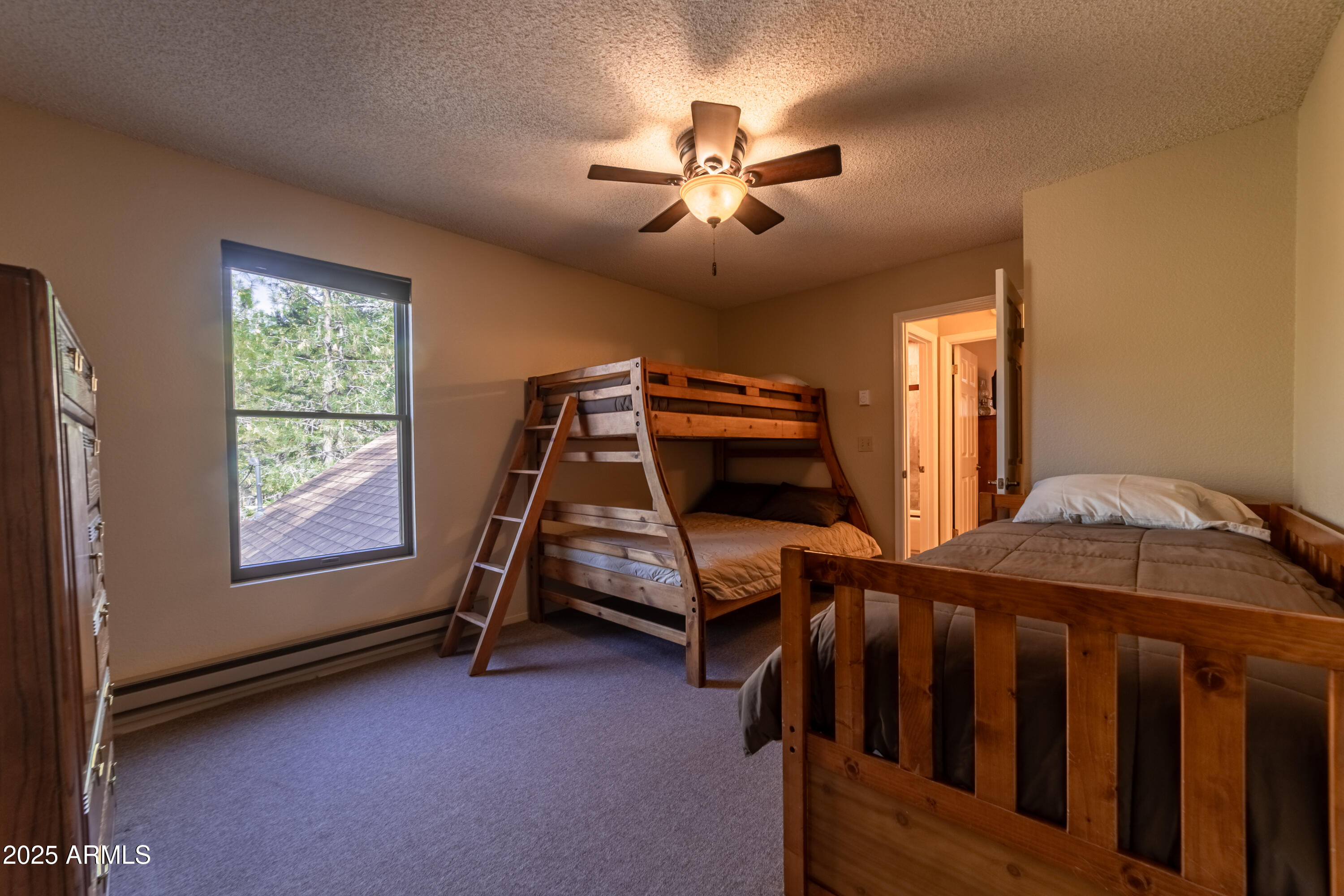 3929 East Sheldon Road Prescott, AZ 86303 - Photo 25 of 36 a bedroom with double bunk beds and a window