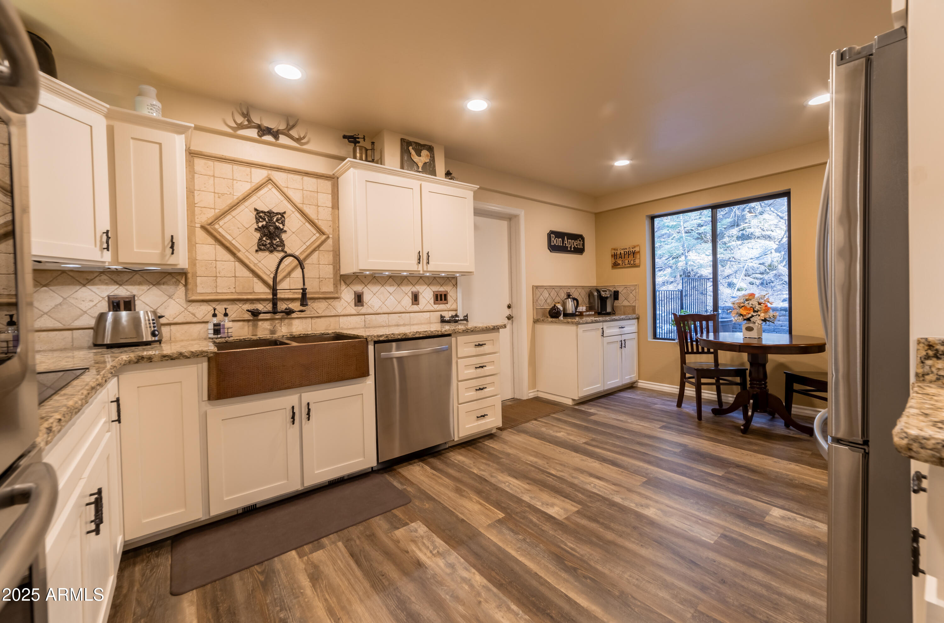 3929 East Sheldon Road Prescott, AZ 86303 - Photo 4 of 36 a kitchen with a sink window and chairs