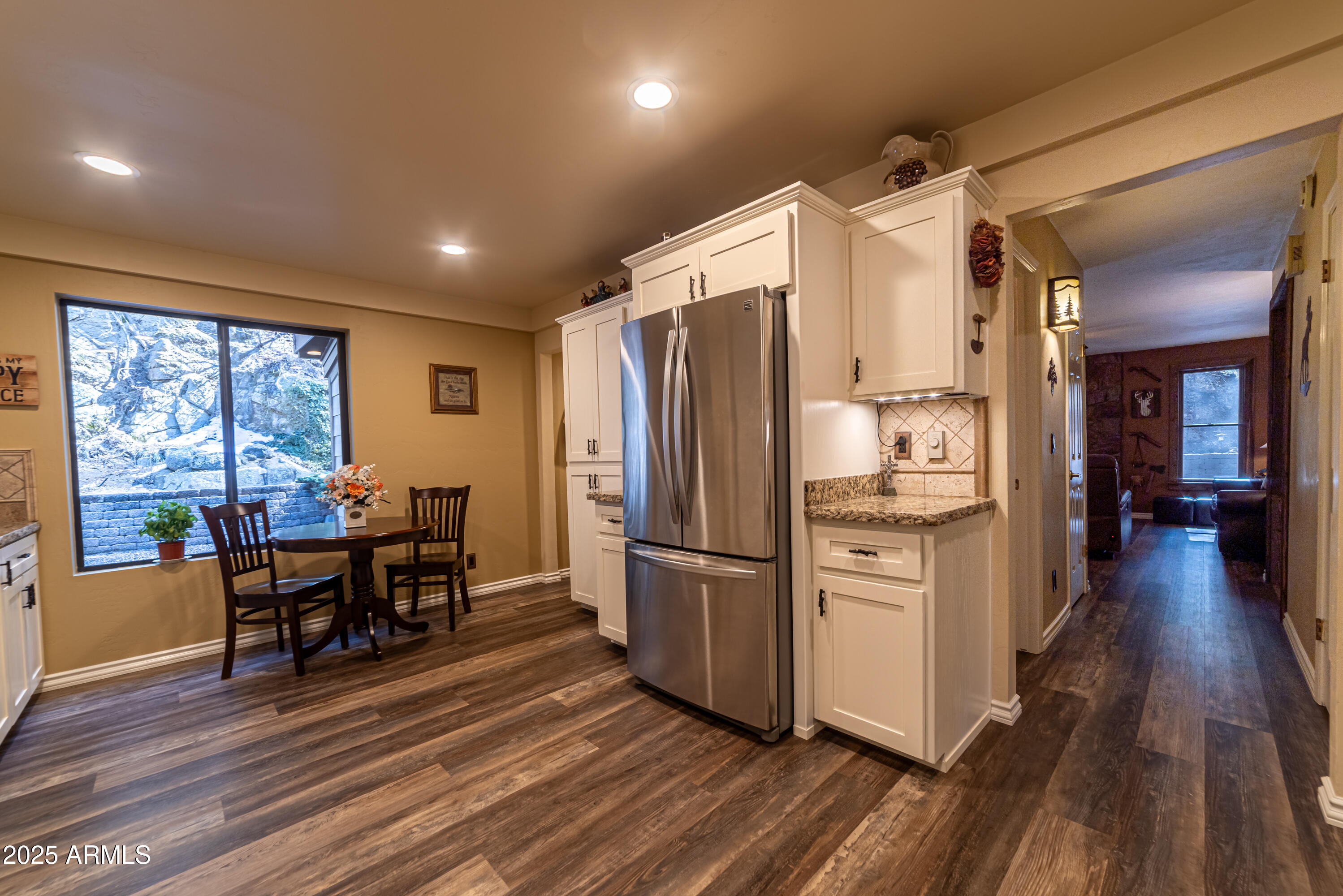 3929 East Sheldon Road Prescott, AZ 86303 - Photo 6 of 36 a kitchen with stainless steel appliances a refrigerator a table and chairs