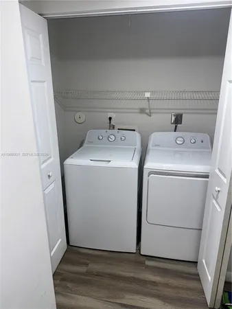 a utility room with dryer and washer
