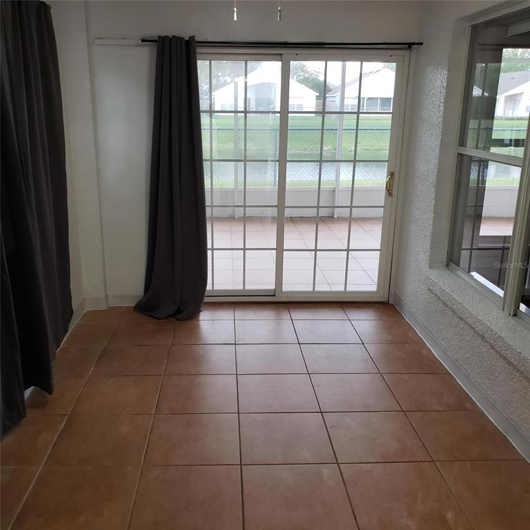 14111 Colonial Spring Way Orlando, FL 32826 - Photo 11 of 26 a view of an empty room and window