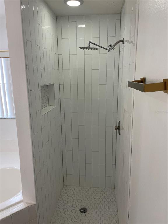 14111 Colonial Spring Way Orlando, FL 32826 - Photo 16 of 26 a bathroom with a shower