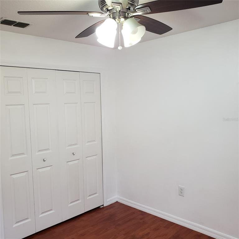 14111 Colonial Spring Way Orlando, FL 32826 - Photo 22 of 26 a view of a room with wooden floor