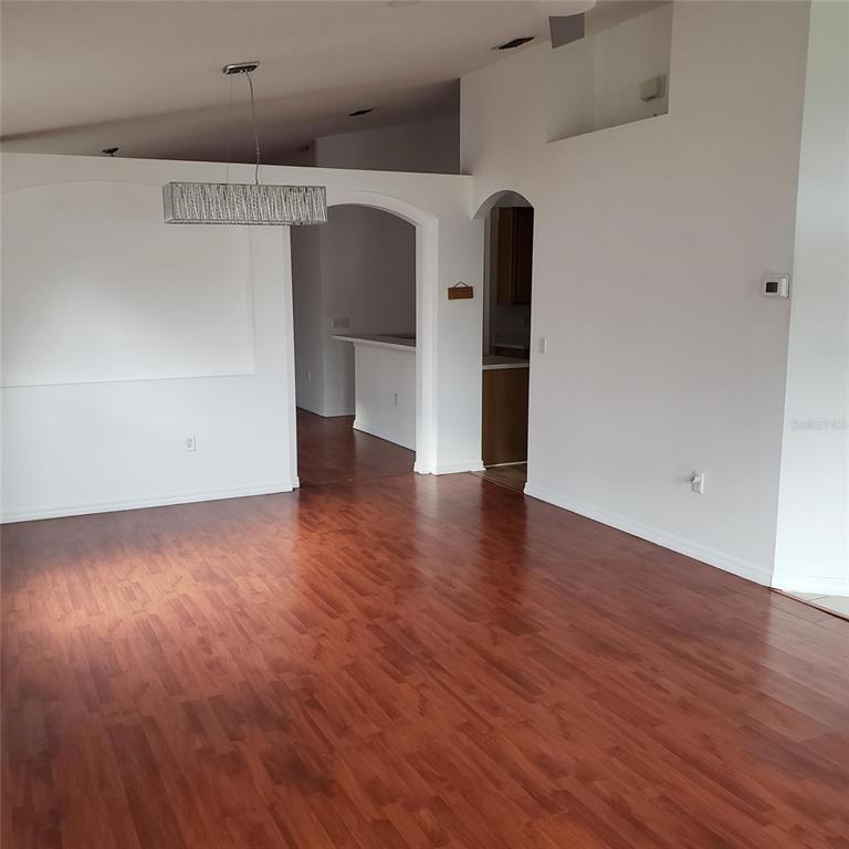 14111 Colonial Spring Way Orlando, FL 32826 - Photo 5 of 26 a view of a hallway with wooden floor