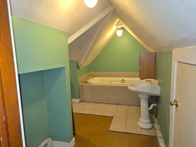 a bathroom with a sink and mirror