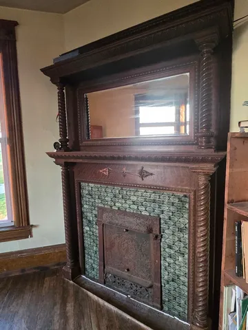 a fireplace with a clock on top of it