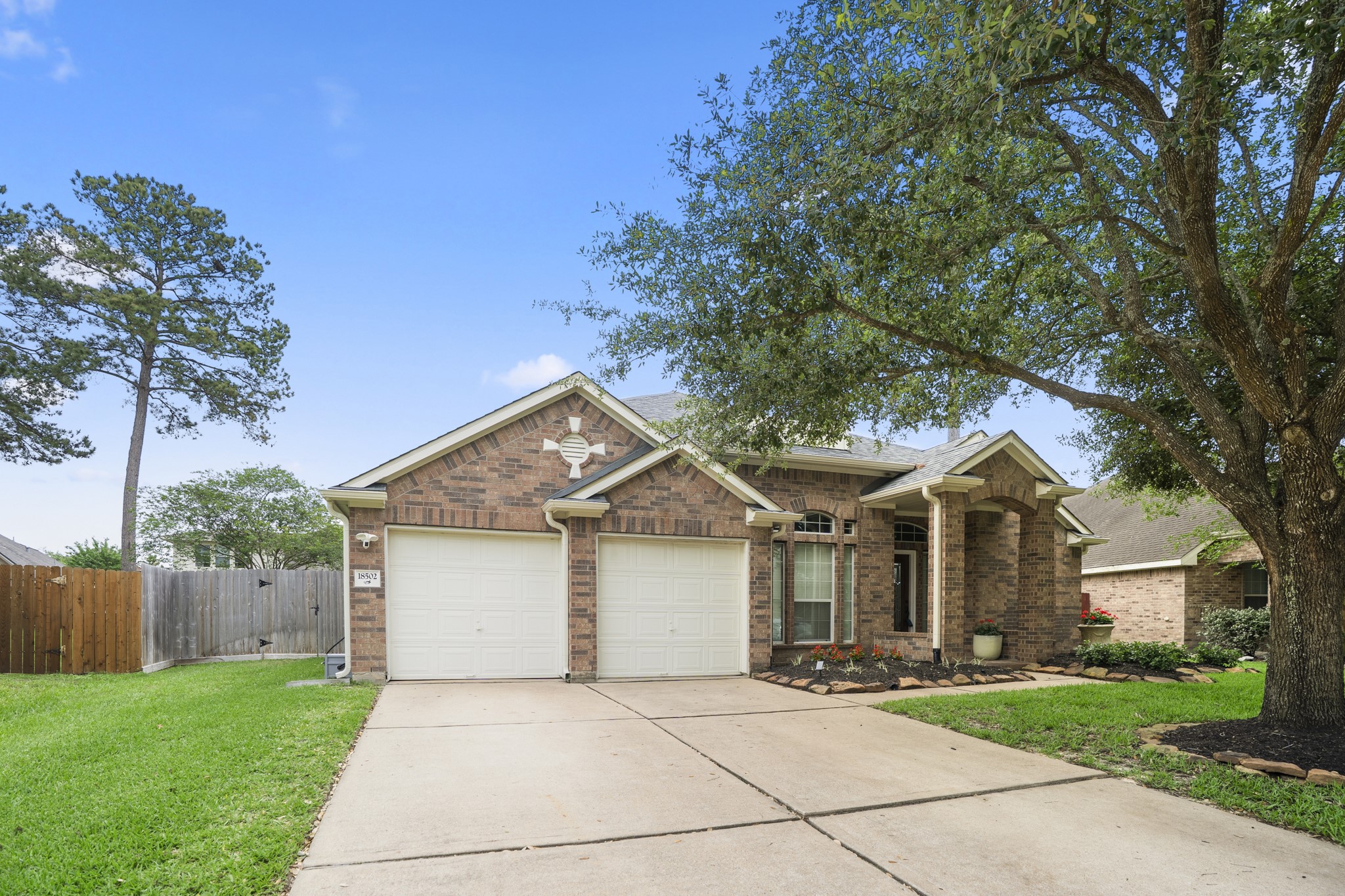 18502 Cascade Timbers Lane Tomball, TX 77377 - Photo 2 of 43 Charming one-story home in the sought-after Villages of Northpointe, beautifully updated and full of curb appeal. A mature oak tree anchors the front yard, offering shade and a warm, welcoming presence, while the well-maintained landscaping and inviting exterior set the tone for what’s inside.