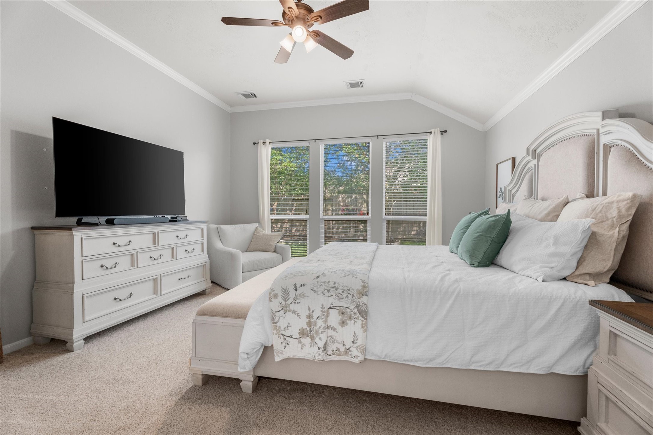 18502 Cascade Timbers Lane Tomball, TX 77377 - Photo 21 of 43 The bedroom overlooks lush vegetation outside where birds and natural beauty create a serene, retreat-like setting.
