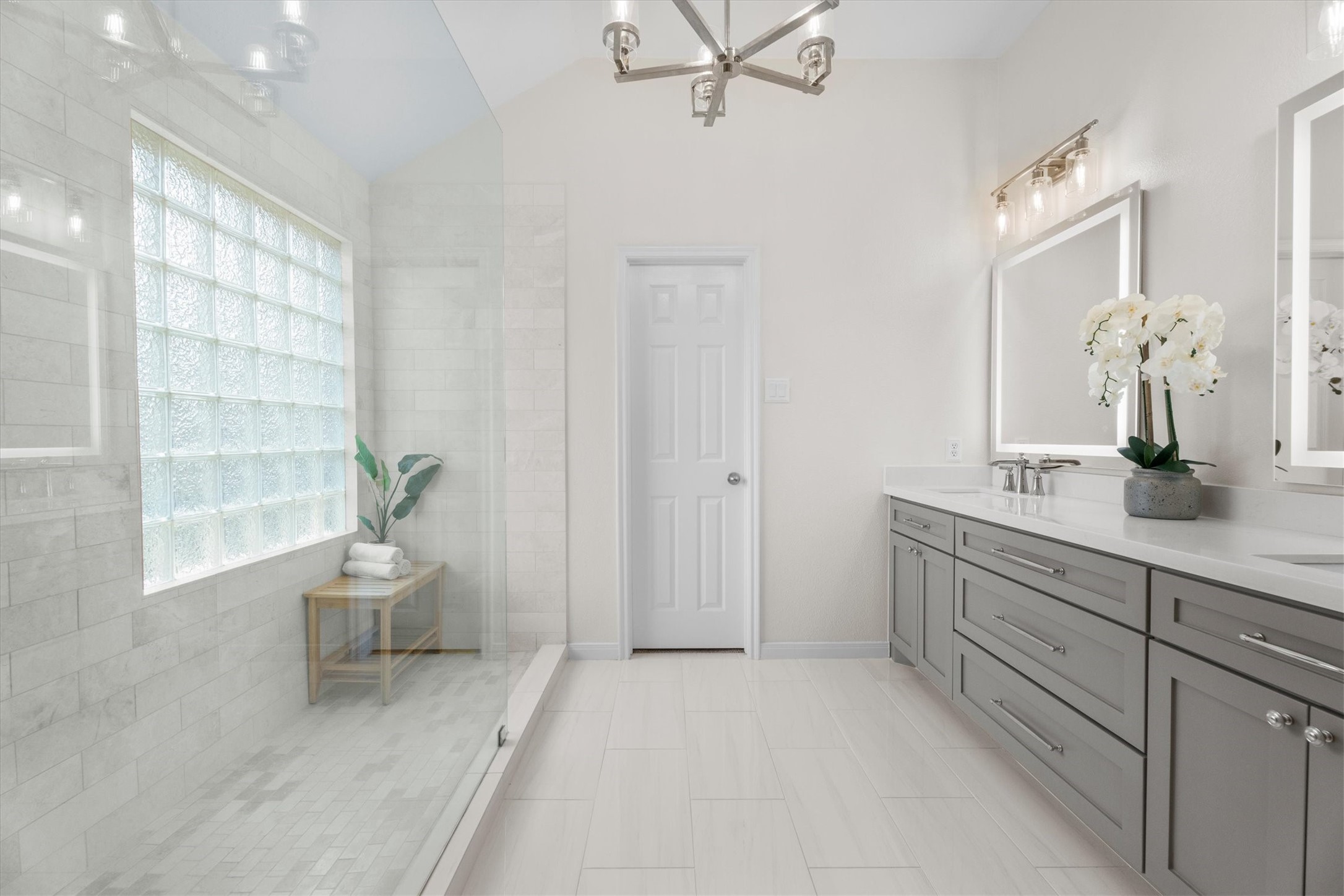 18502 Cascade Timbers Lane Tomball, TX 77377 - Photo 24 of 43 From the updated vanity to the upgraded light fixtures and mirrors, every detail has been thoughtfully chosen to create a dream bathroom.