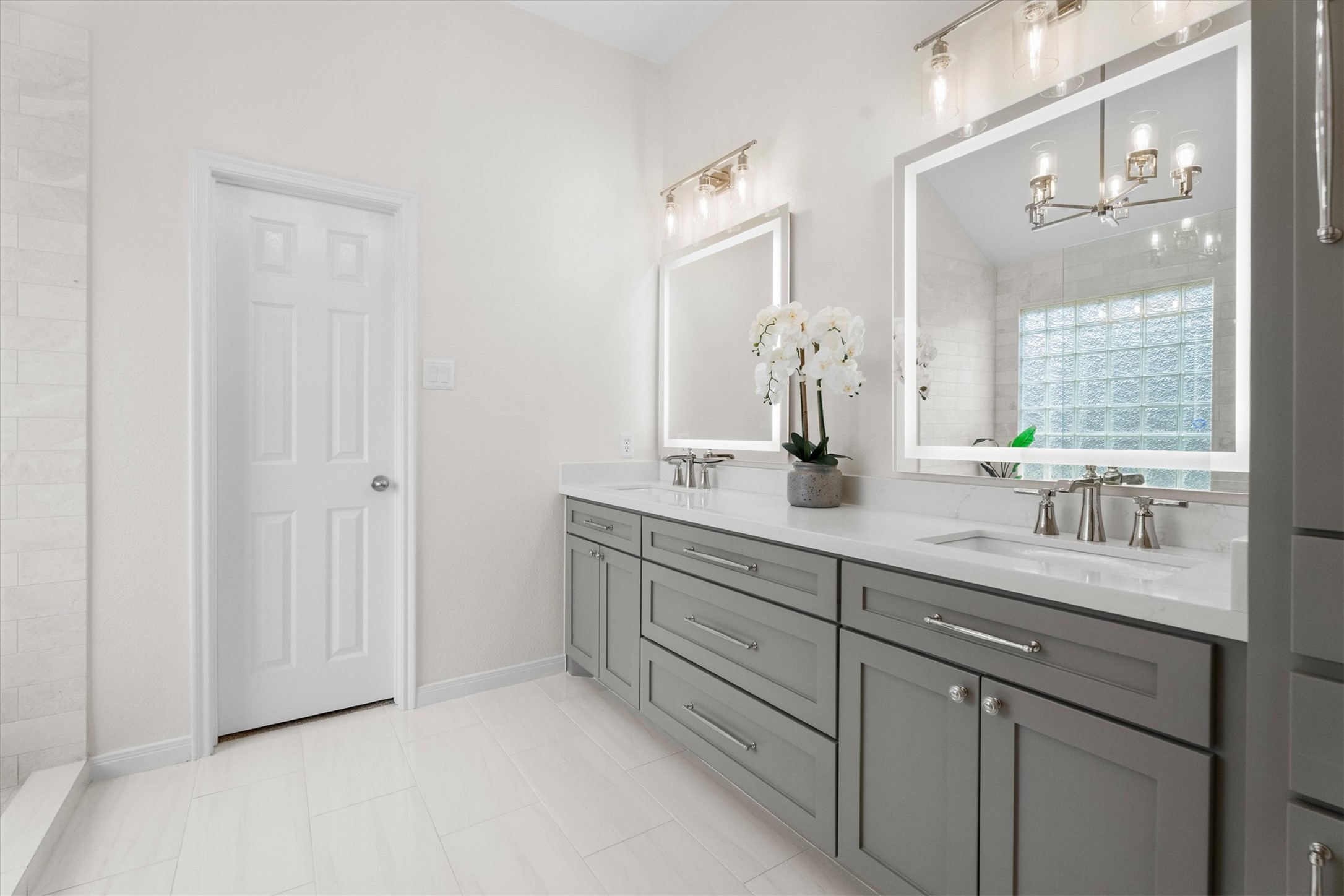 18502 Cascade Timbers Lane Tomball, TX 77377 - Photo 25 of 43 Updated vanity, light fixtures, and mirrors come together to create a true dream bathroom.