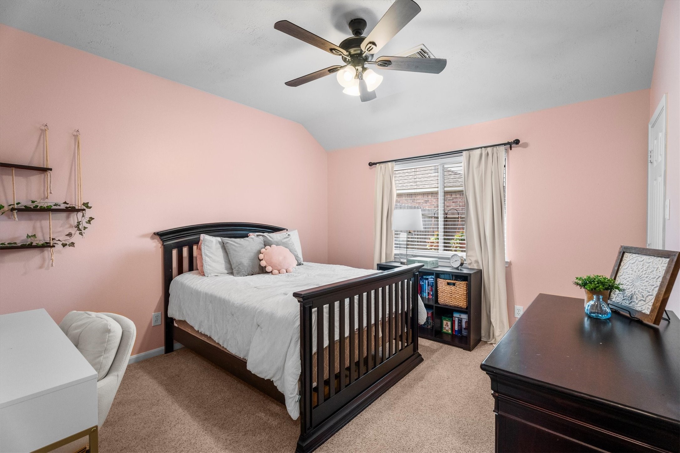 18502 Cascade Timbers Lane Tomball, TX 77377 - Photo 27 of 43 This generously sized secondary bedroom features a ceiling fan for added comfort and plenty of closet space to keep everything organized.
