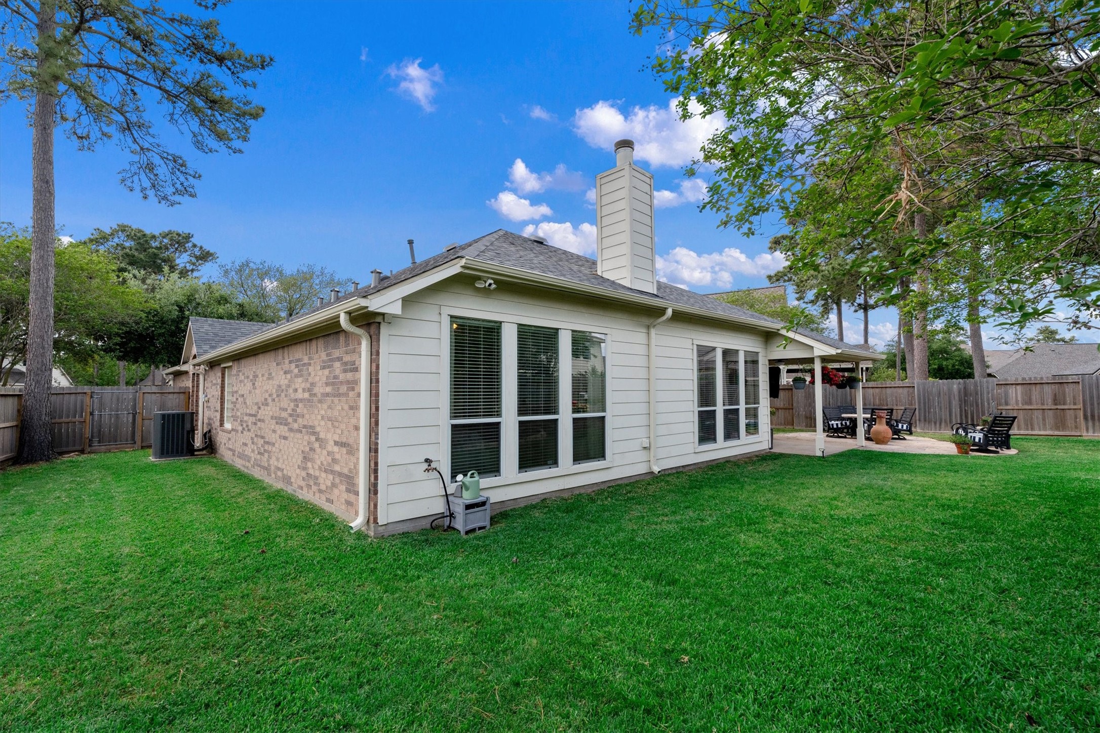 18502 Cascade Timbers Lane Tomball, TX 77377 - Photo 32 of 43 The generous side yards offer plenty of open space for play, pets, or gardening, adding to the home’s overall versatility and outdoor enjoyment.