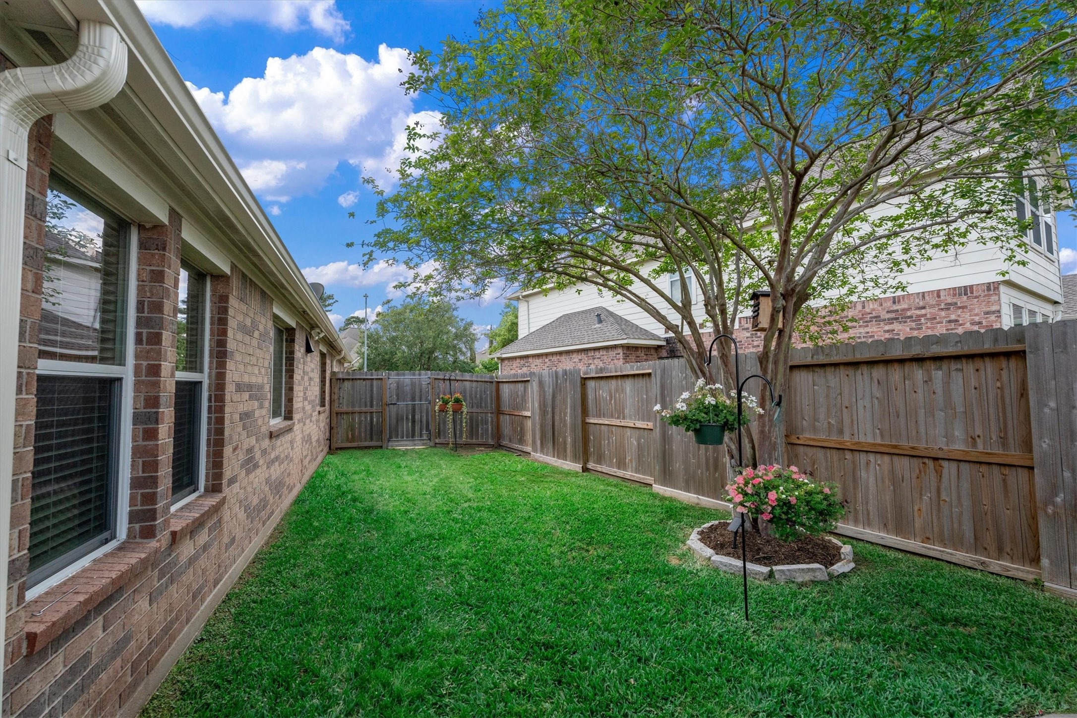 18502 Cascade Timbers Lane Tomball, TX 77377 - Photo 33 of 43 The other side yard is spacious enough to accommodate lawn equipment or trash cans. This would also be a lovely place for a garden.