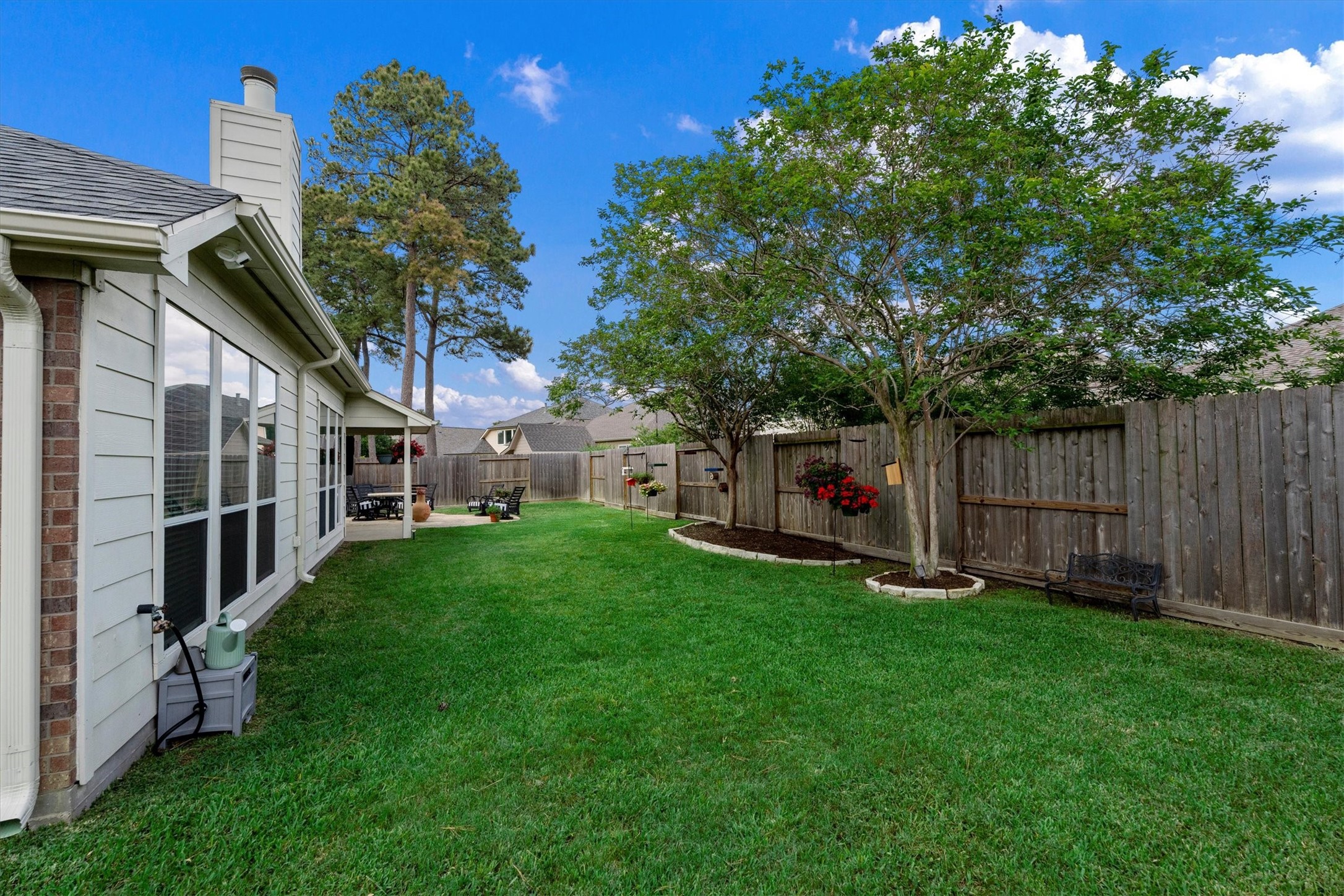 18502 Cascade Timbers Lane Tomball, TX 77377 - Photo 34 of 43 The beautiful backyard attracts a variety of unique and lovely birds, adding to its peaceful, nature-filled setting.