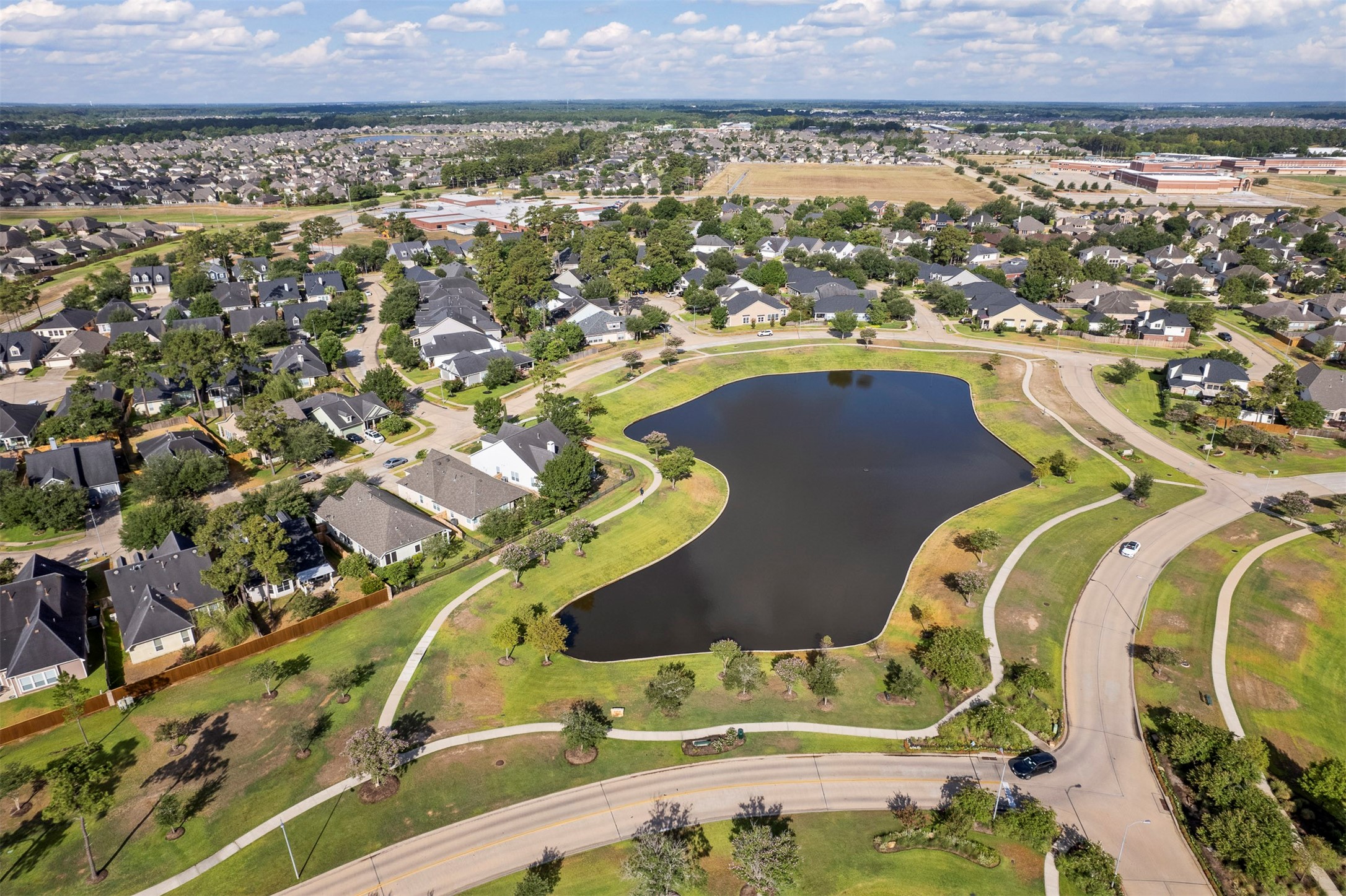 18502 Cascade Timbers Lane Tomball, TX 77377 - Photo 38 of 43 The community is full of lakes surrounded by walking paths.