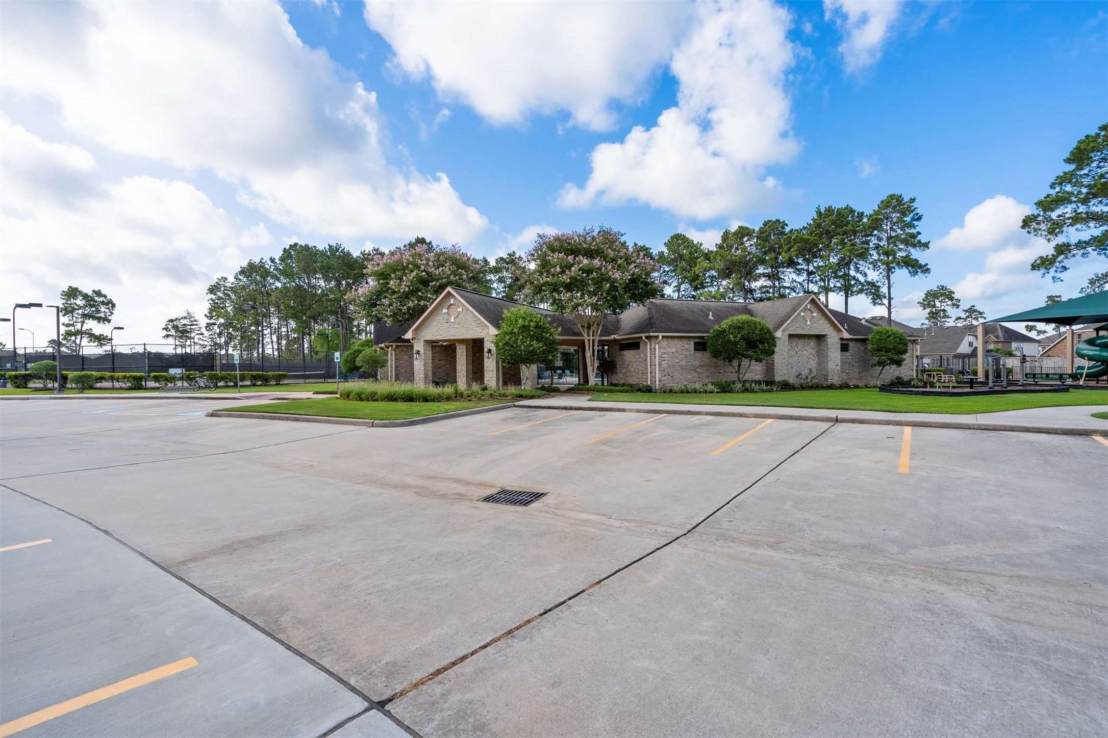 18502 Cascade Timbers Lane Tomball, TX 77377 - Photo 39 of 43 The community clubhouse offers a welcoming space for gatherings, events, and connecting with neighbors.