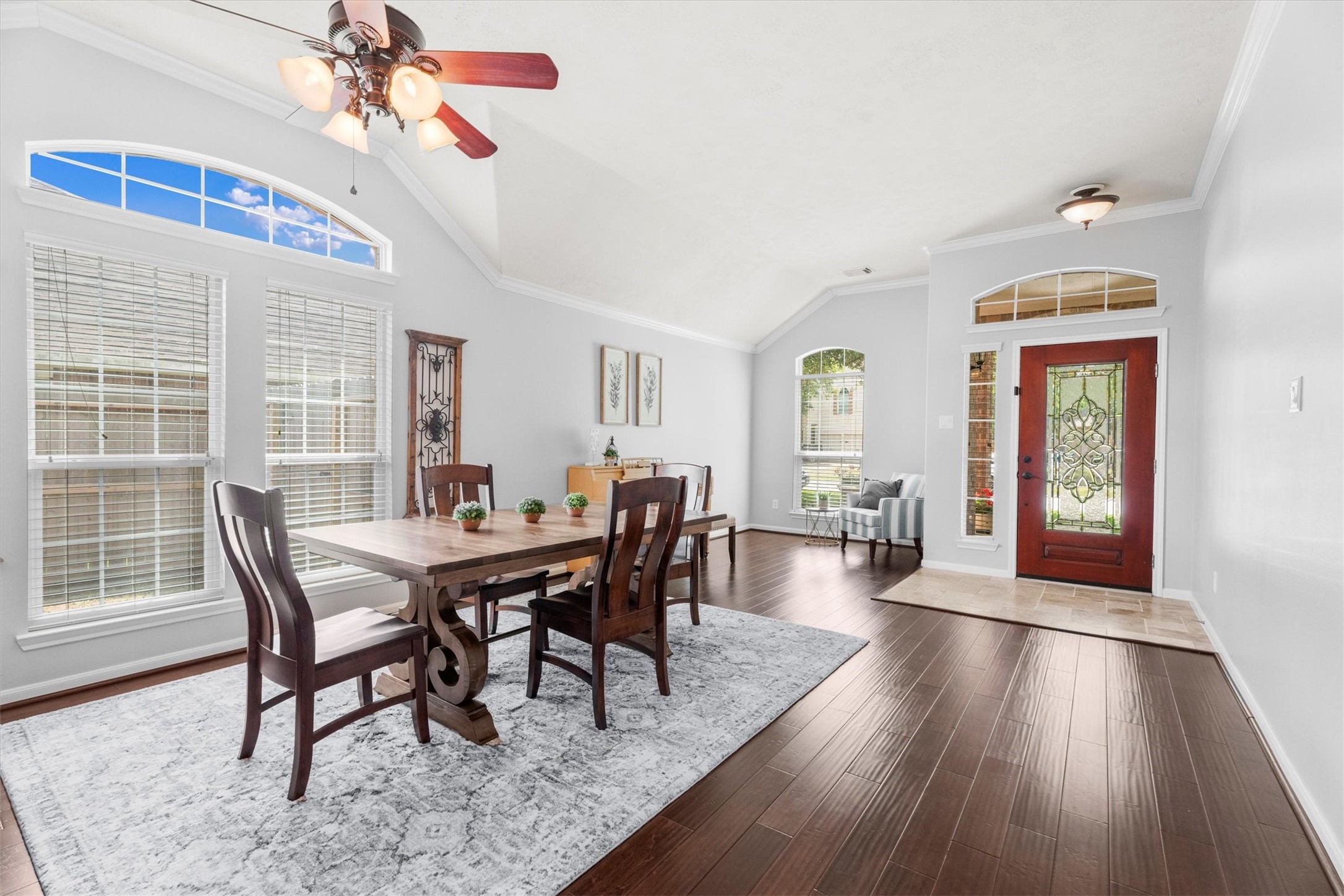 18502 Cascade Timbers Lane Tomball, TX 77377 - Photo 6 of 43 Just off the entry, this spacious front room offers incredible flexibility—currently styled as a formal living and dining space, but easily suited for a home office, gameroom, or additional living area to fit your lifestyle.