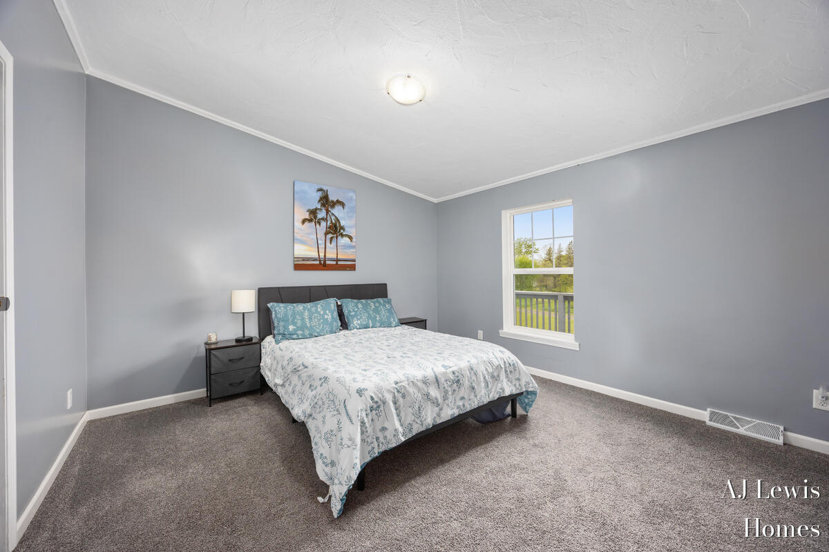 4810 Buehler Road Hastings, MI 49058 - Photo 11 of 25 Master bedroom w/vaulted ceilings