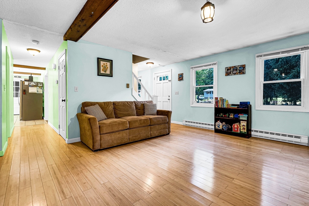 102 Lower Gore Road Webster, MA 01570 - Photo 12 of 40 a living room with furniture and wooden floor