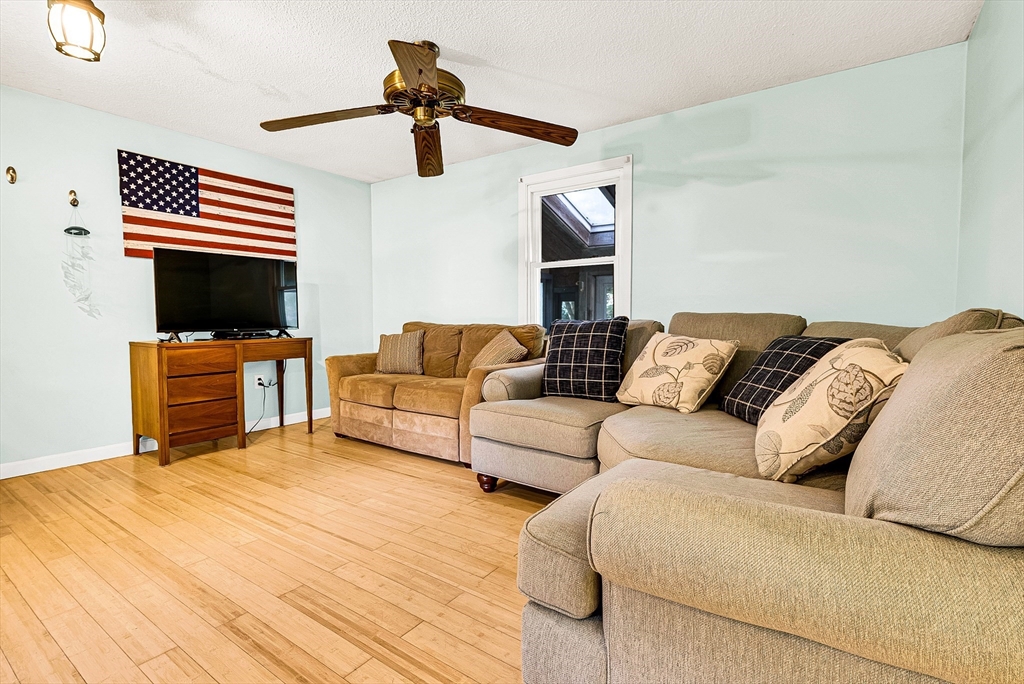 102 Lower Gore Road Webster, MA 01570 - Photo 15 of 40 a living room with furniture and a fireplace