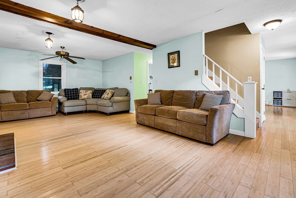 102 Lower Gore Road Webster, MA 01570 - Photo 16 of 40 a living room with furniture and a wooden floor