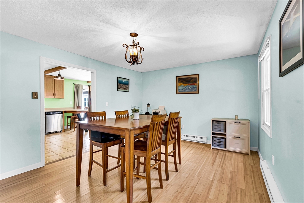 102 Lower Gore Road Webster, MA 01570 - Photo 19 of 40 a view of a dining room with furniture and wooden floor