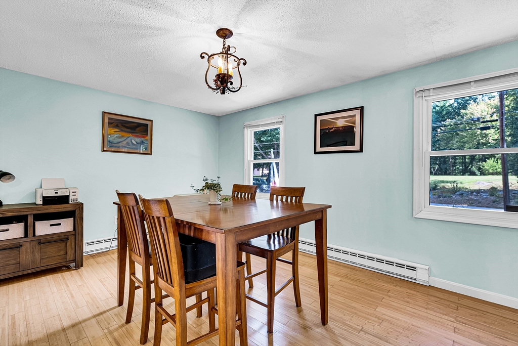 102 Lower Gore Road Webster, MA 01570 - Photo 20 of 40 a view of a dining room with furniture window and wooden floor