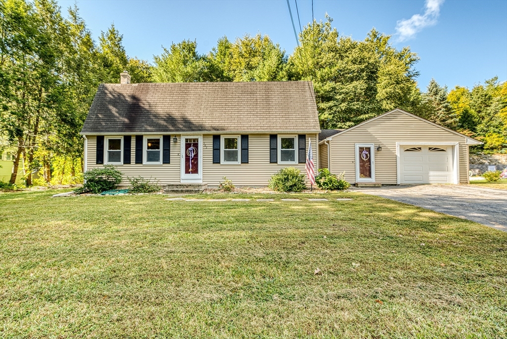 102 Lower Gore Road Webster, MA 01570 - Photo 2 of 40 a front view of a house with a garden