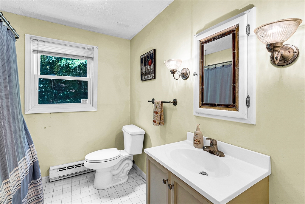 102 Lower Gore Road Webster, MA 01570 - Photo 21 of 40 a bathroom with a toilet sink and mirror