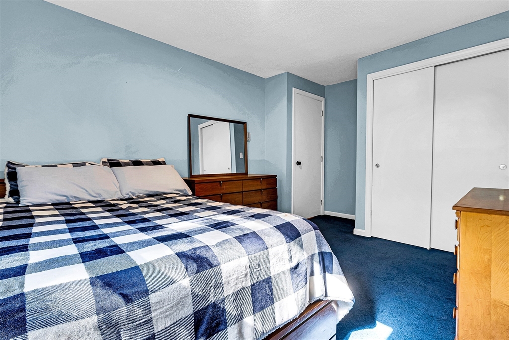 102 Lower Gore Road Webster, MA 01570 - Photo 25 of 40 a bedroom with a bed and wooden floor