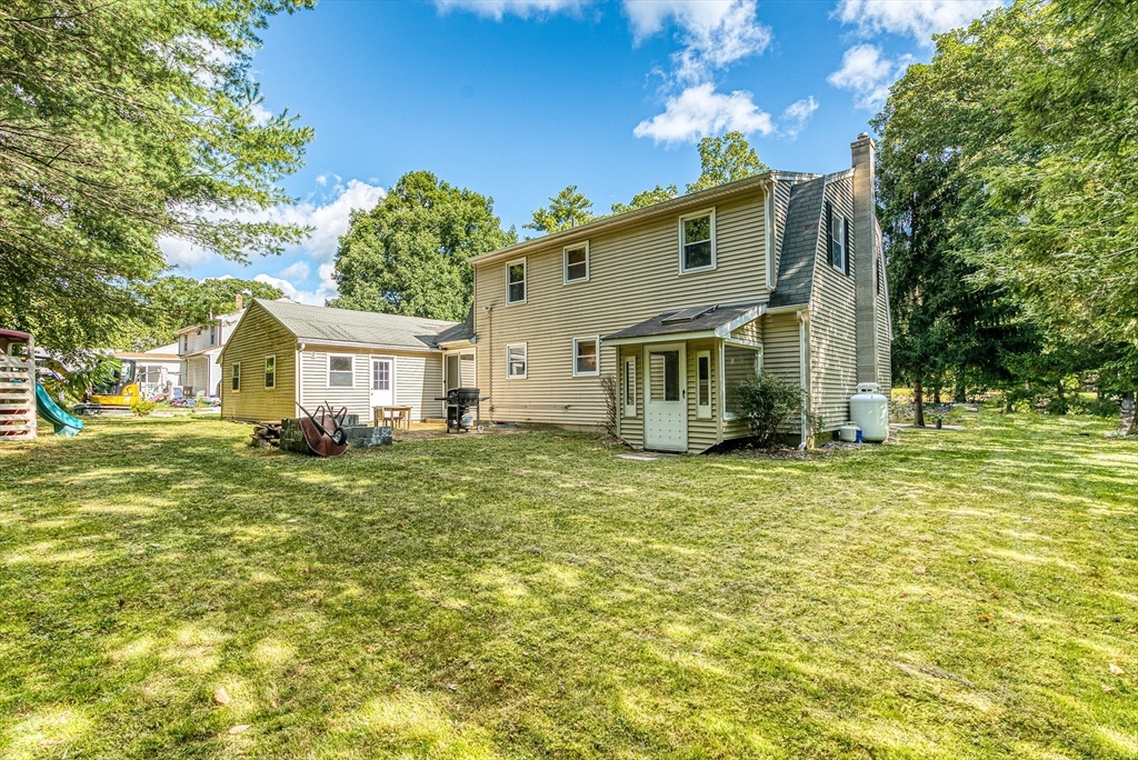 102 Lower Gore Road Webster, MA 01570 - Photo 32 of 40 a front view of a house with a garden