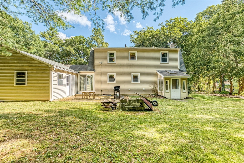 102 Lower Gore Road Webster, MA 01570 - Photo 34 of 40 a view of a house with a patio and a yard