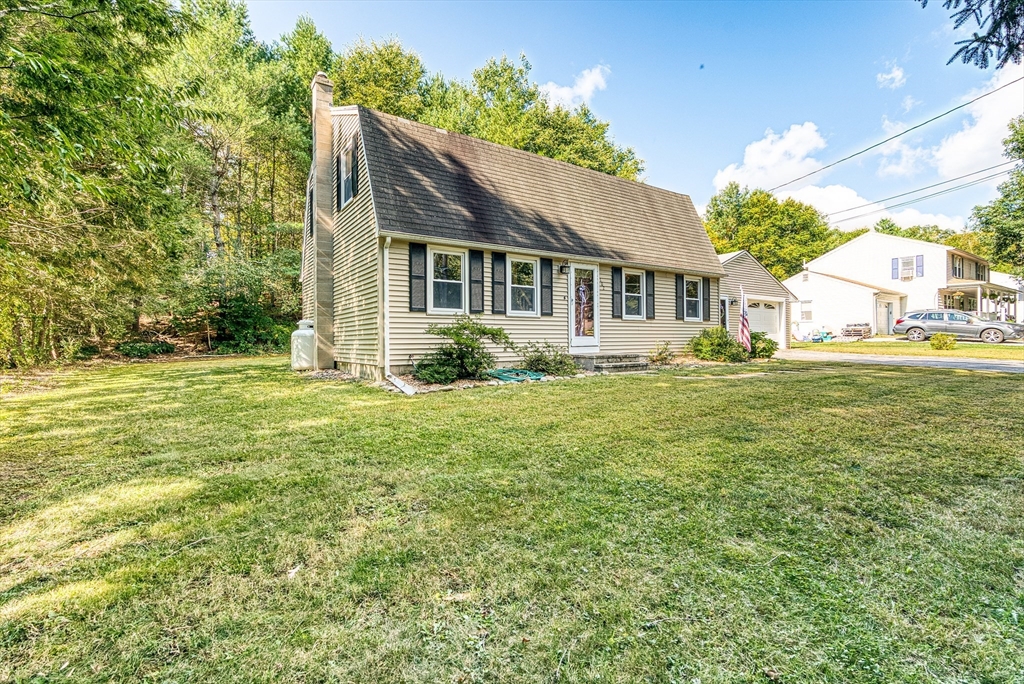 102 Lower Gore Road Webster, MA 01570 - Photo 4 of 40 a front view of a house with a garden