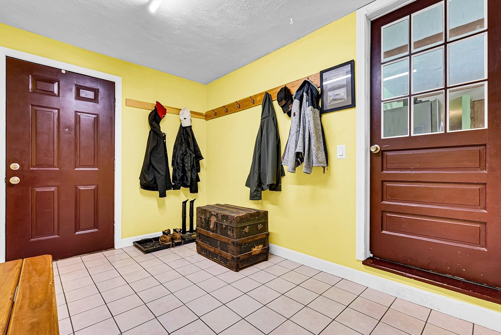 102 Lower Gore Road Webster, MA 01570 - Photo 6 of 40 a living room with a bed and a walk in closet