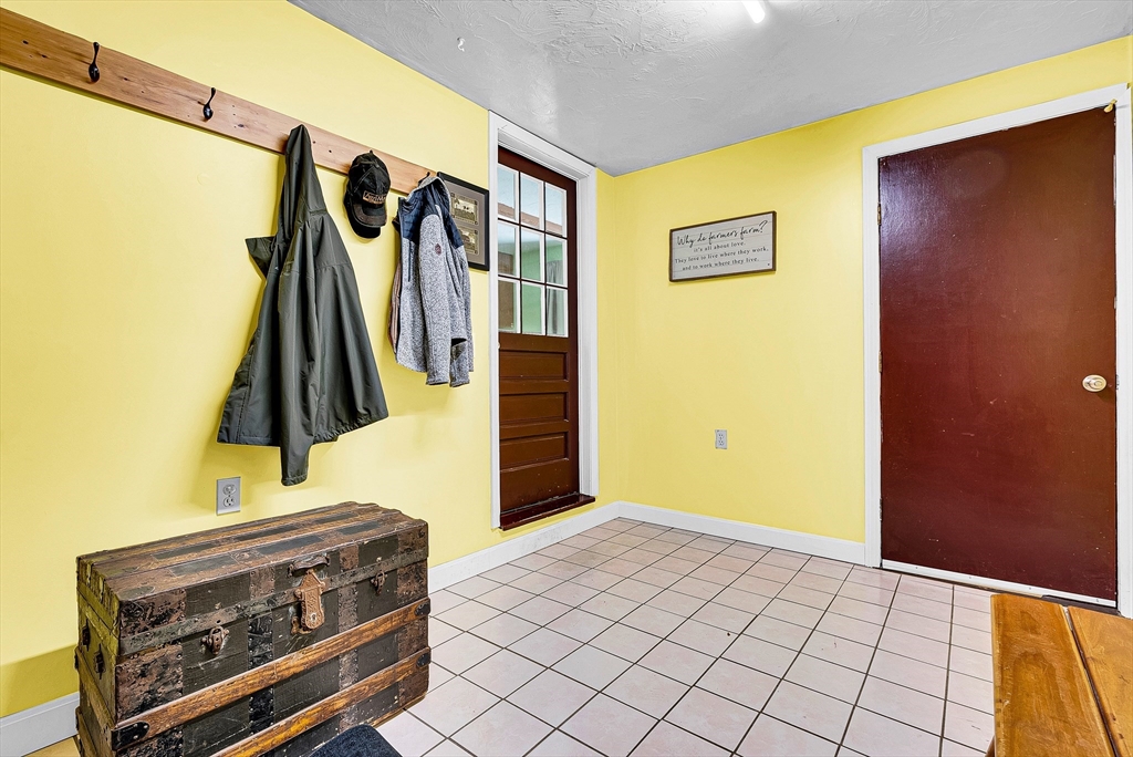 102 Lower Gore Road Webster, MA 01570 - Photo 7 of 40 a view of walk in closet with clothes and shoes
