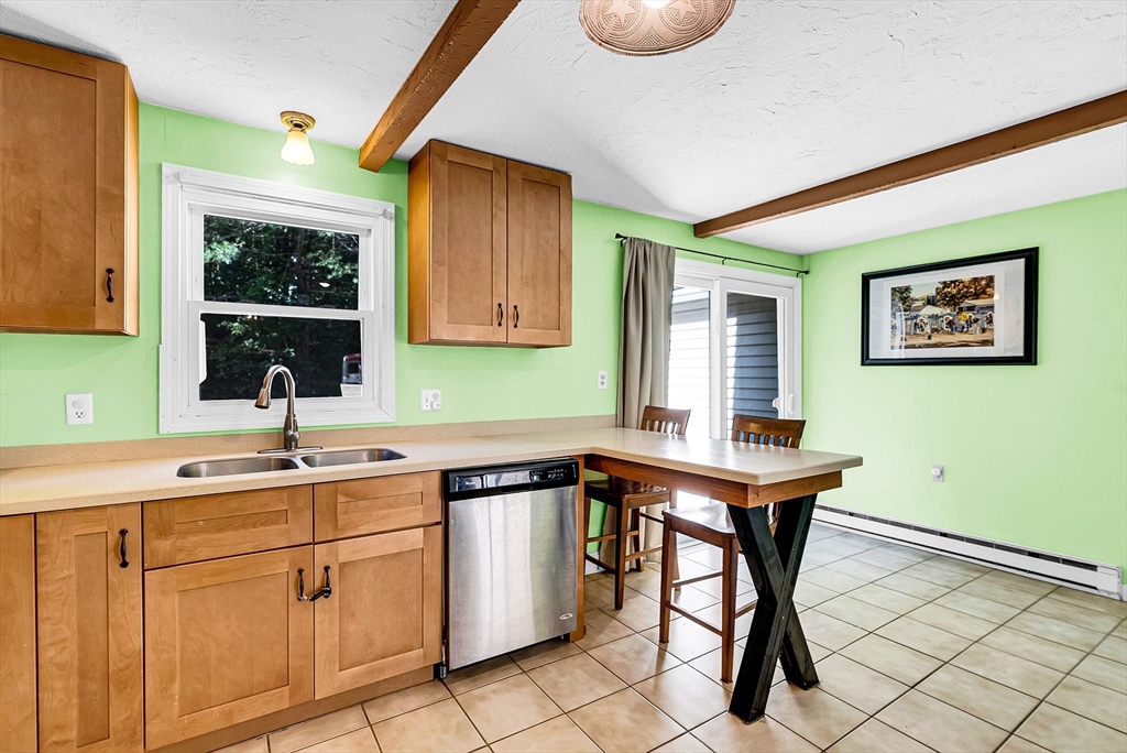 102 Lower Gore Road Webster, MA 01570 - Photo 10 of 40 a kitchen with a sink cabinets and window
