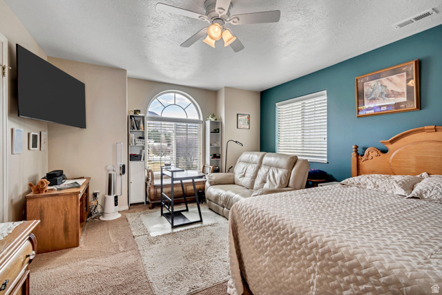 1697 North 500 West Mapleton, UT 84664 - Photo 22 of 50 Carpeted bedroom featuring a textured ceiling and ceiling fan