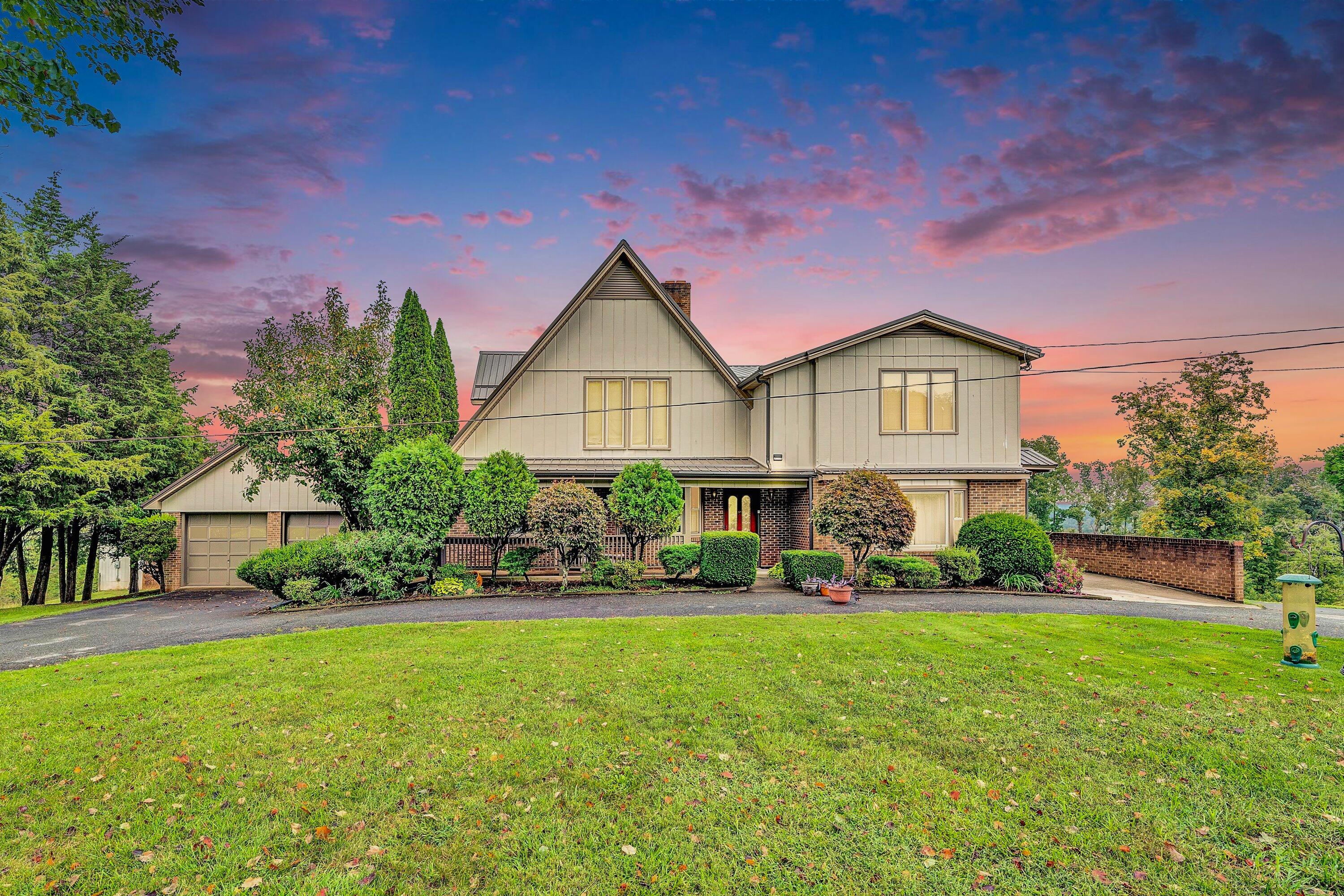1117 Bouldin Road Ridgeway, VA 24148 - Photo 1 of 70 a front view of a house with a yard and potted plants