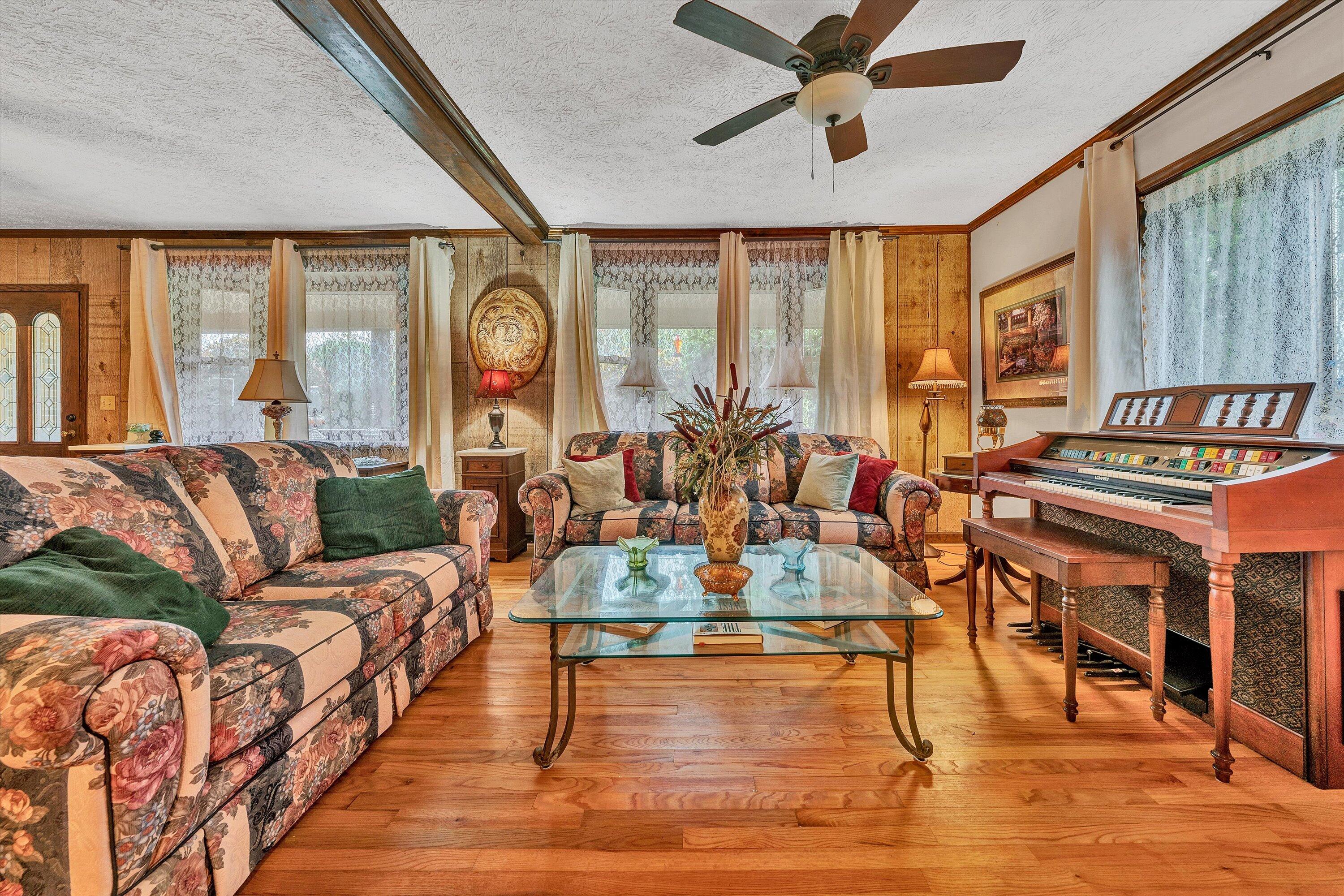 1117 Bouldin Road Ridgeway, VA 24148 - Photo 11 of 70 a living room with furniture a window and a chandelier
