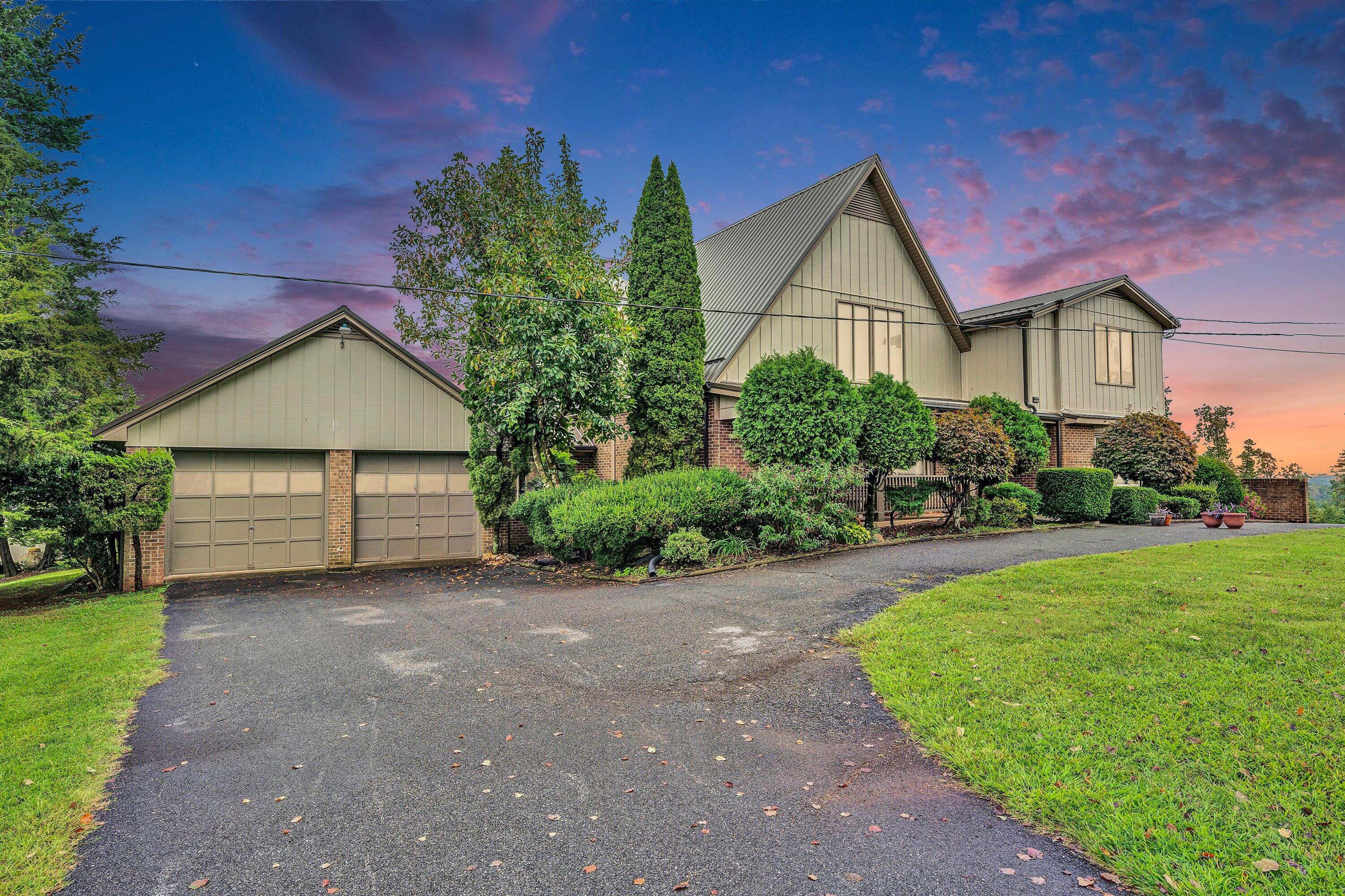 1117 Bouldin Road Ridgeway, VA 24148 - Photo 2 of 70 a view of a house with a yard and potted plants