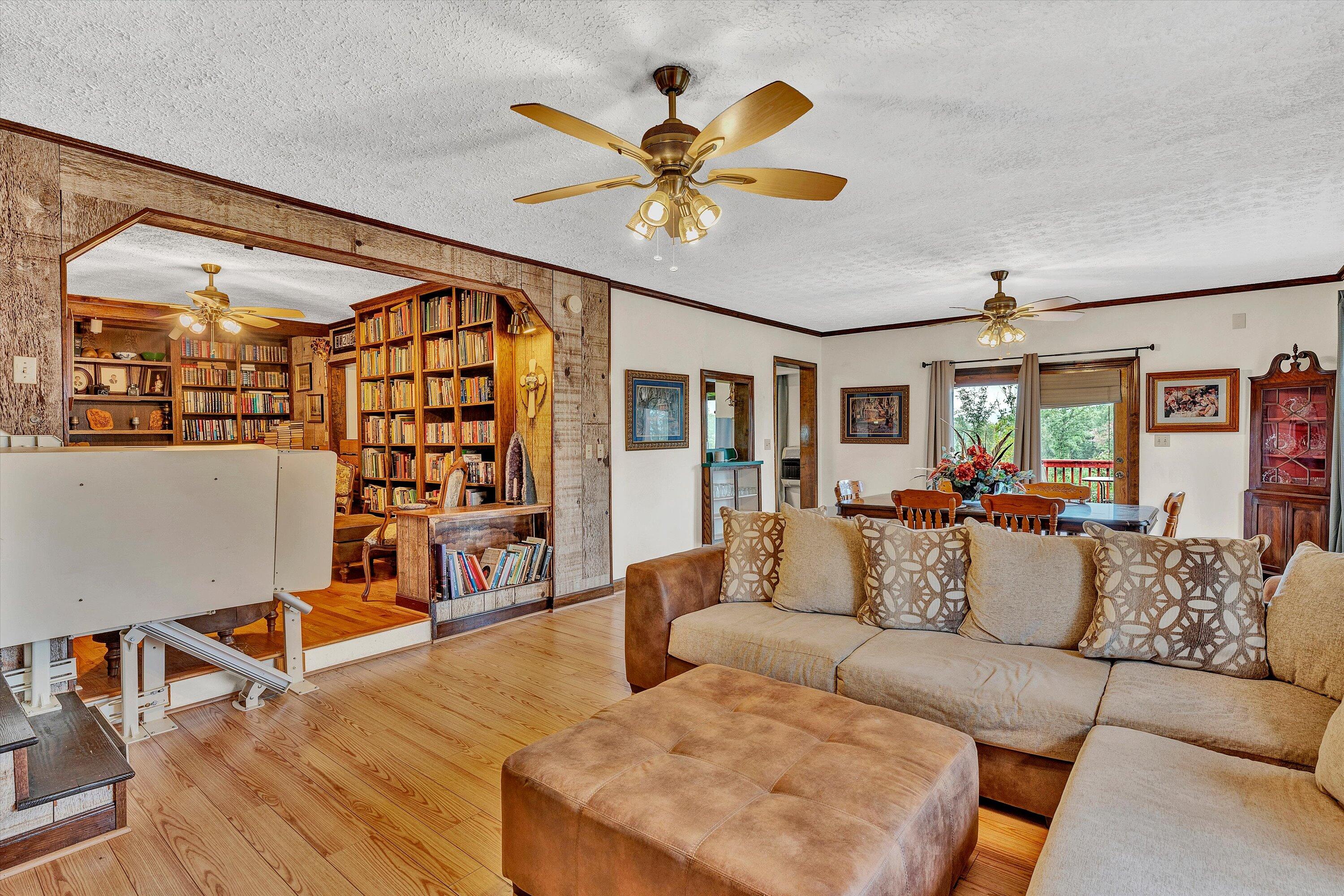 1117 Bouldin Road Ridgeway, VA 24148 - Photo 21 of 70 a living room with furniture a ceiling fan and a rug