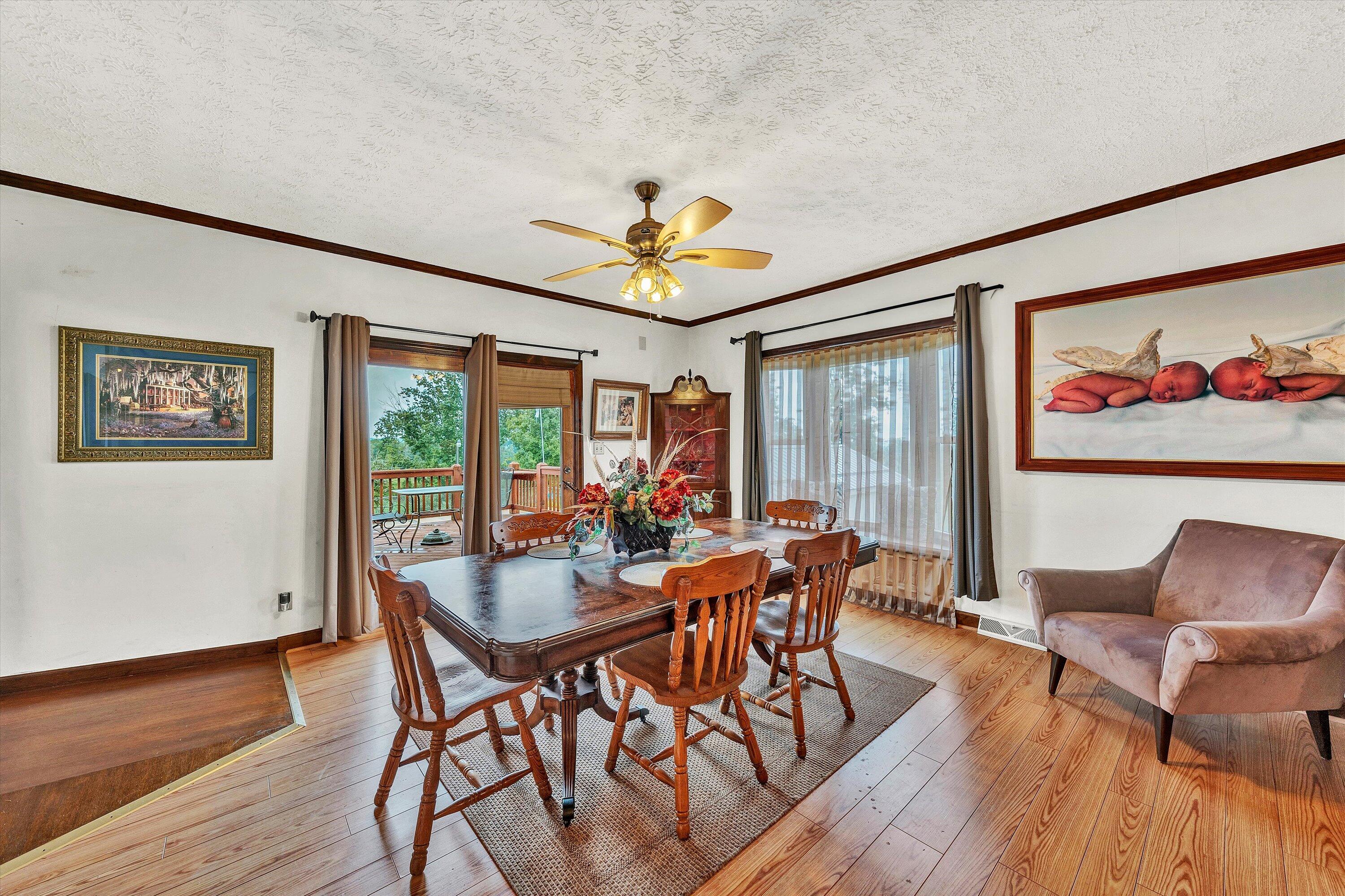 1117 Bouldin Road Ridgeway, VA 24148 - Photo 22 of 70 a view of a dining room with furniture a chandelier and wooden floor