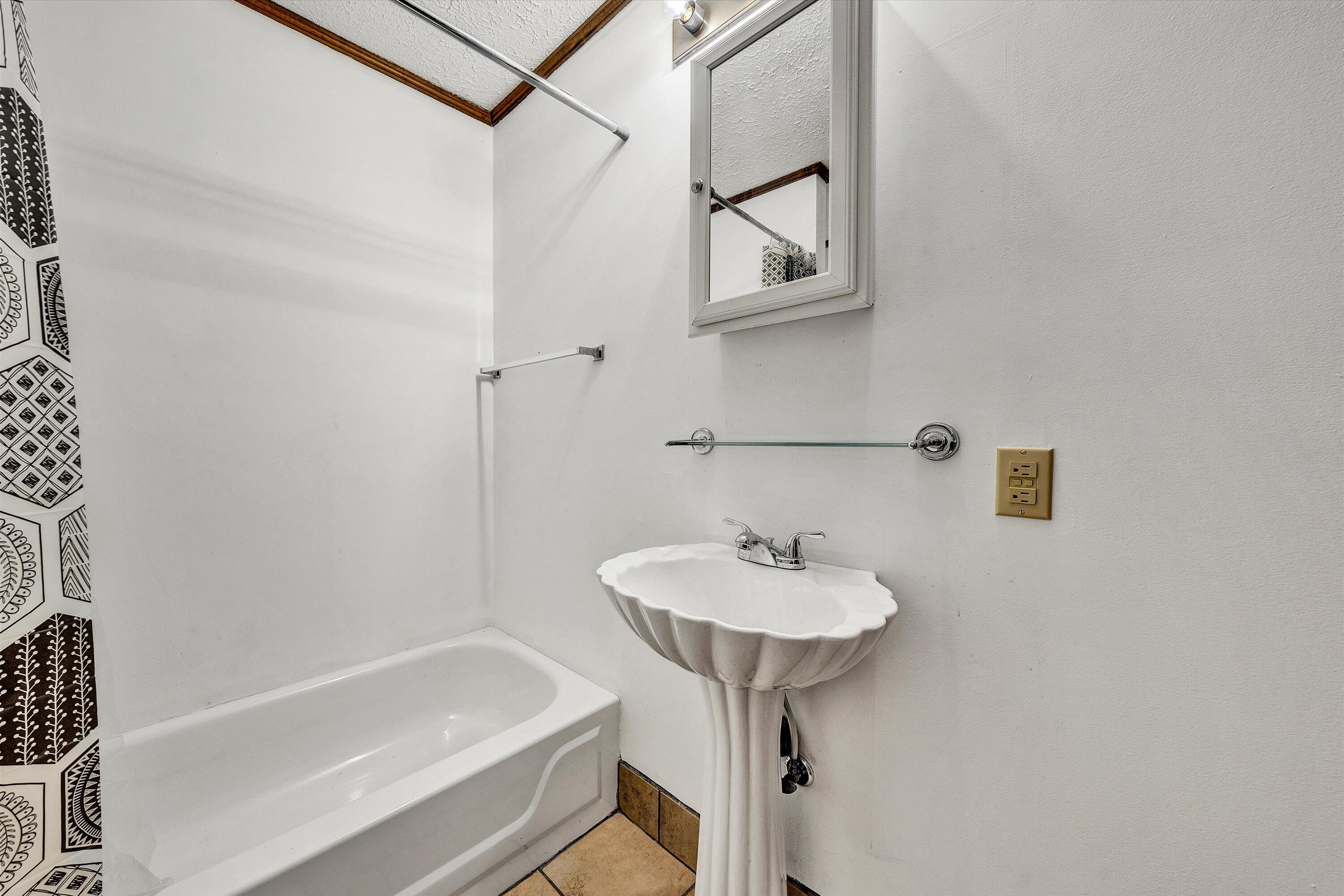1117 Bouldin Road Ridgeway, VA 24148 - Photo 34 of 70 a bathroom with a sink a mirror and a bathtub