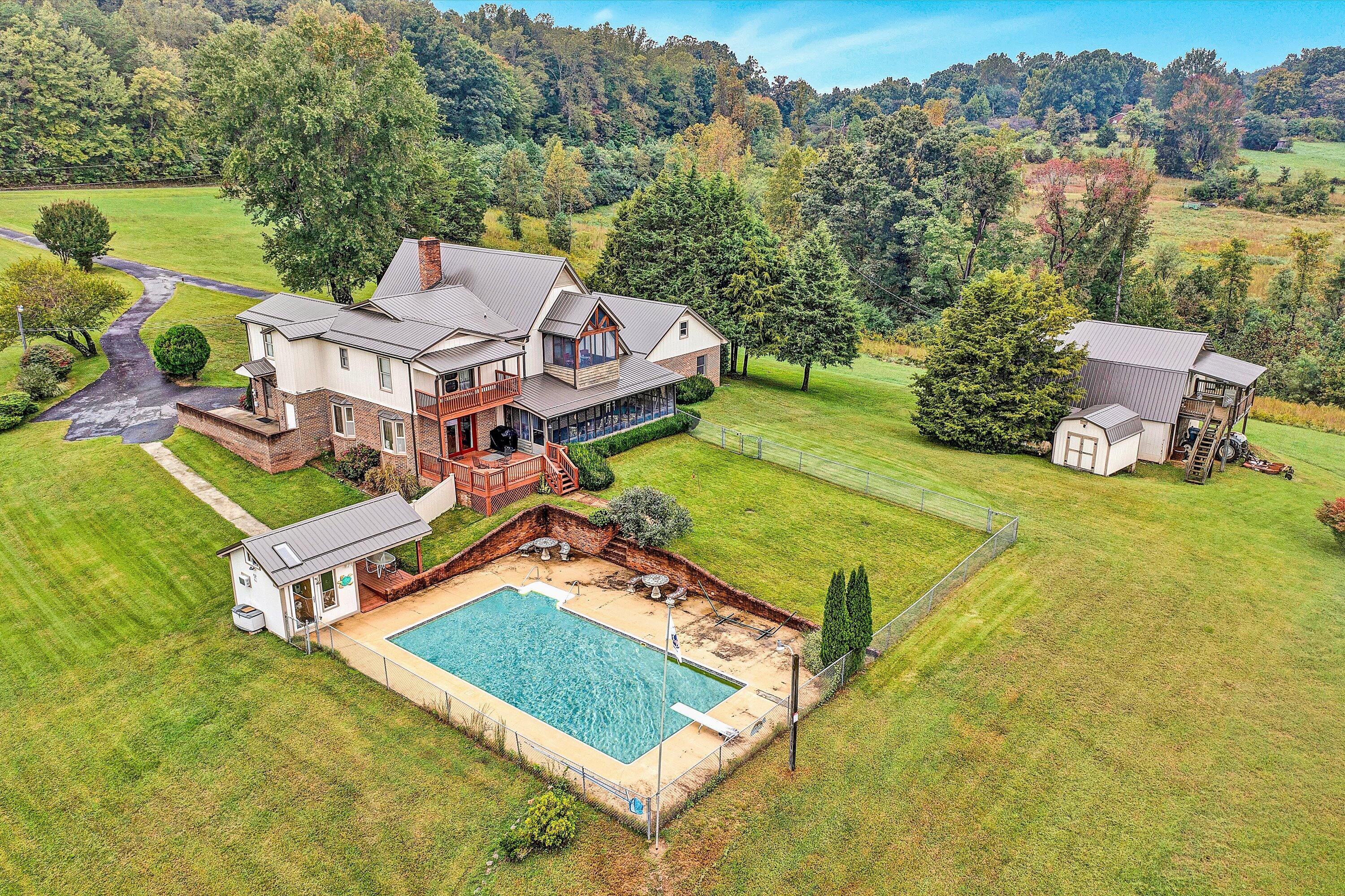 1117 Bouldin Road Ridgeway, VA 24148 - Photo 4 of 70 an aerial view of a house with swimming pool garden and lake view
