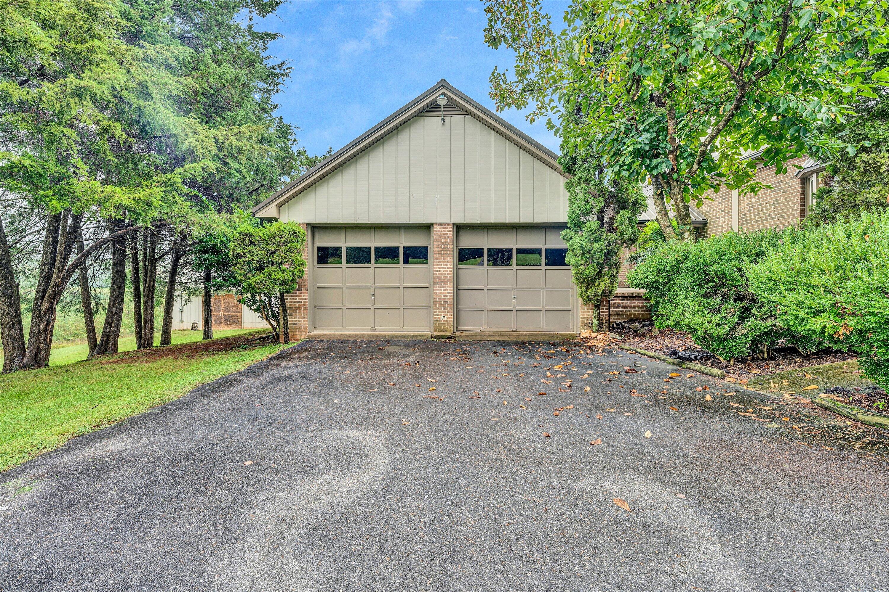 1117 Bouldin Road Ridgeway, VA 24148 - Photo 6 of 70 a view of a house with a yard and large trees