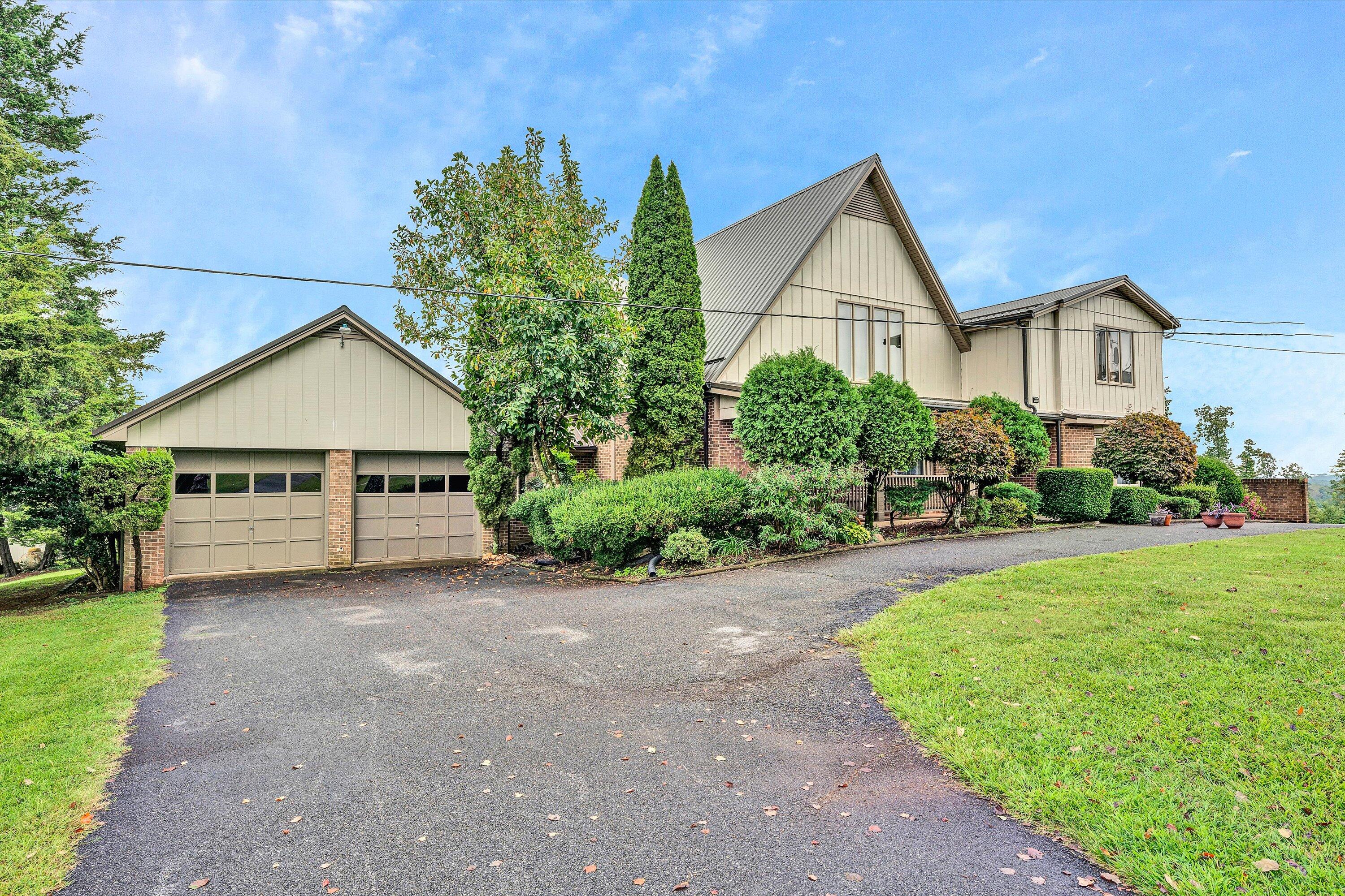 1117 Bouldin Road Ridgeway, VA 24148 - Photo 70 of 70 a view of a house with a yard and potted plants