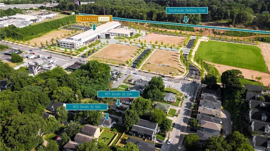 an aerial view of a house with a garden and swimming pool