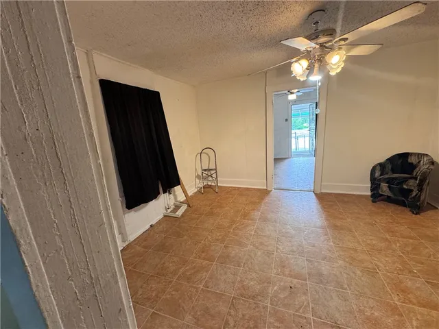 a view of a livingroom with a furniture and a chandelier